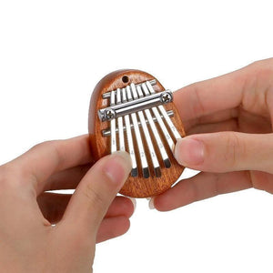 Mini thumb piano